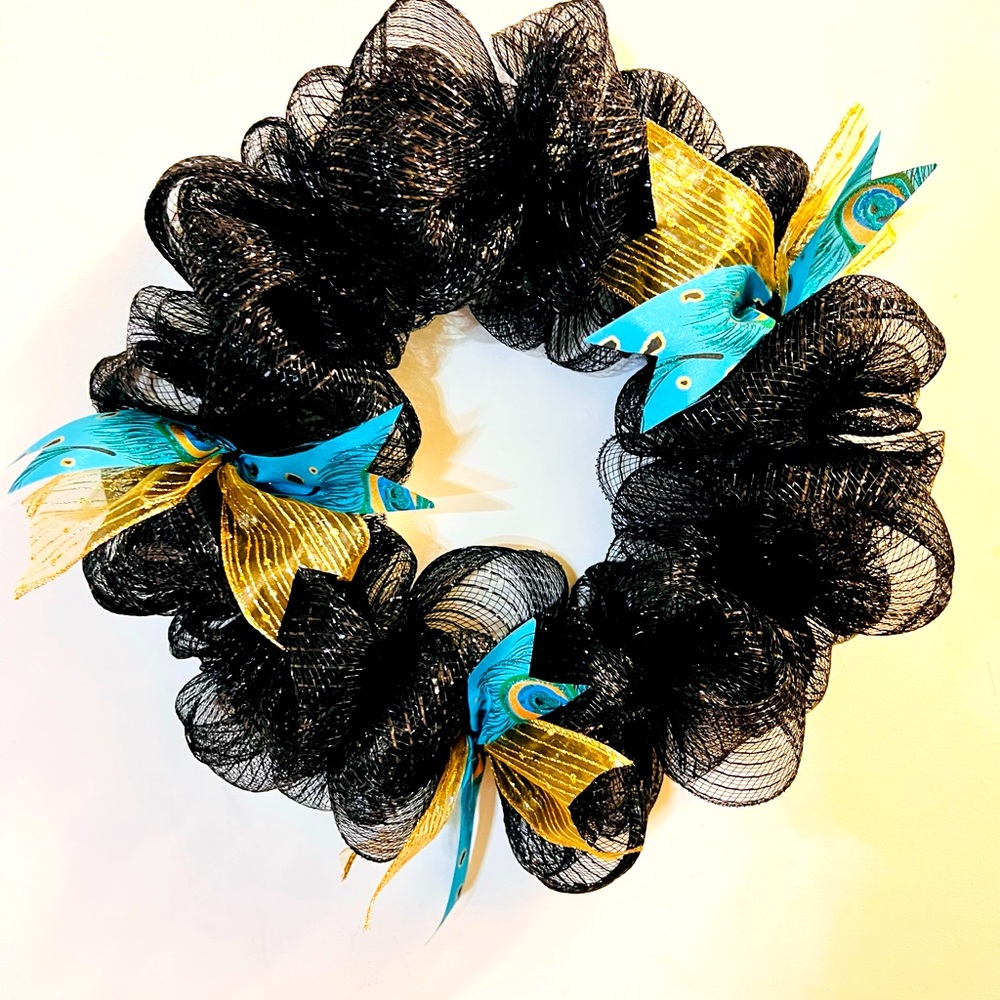 Black wreath with Gold and Peacock ribbon